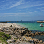 Turquoise clear water around the rocky Glennan Islands, Brittany