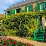 Man stands at window of Claude Monet