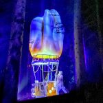 Enchanting lit up forest of Alta Lumina in Les Gets, French Alps