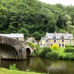 Ancient stone bridge over a river in Lehon near Dinan, Brittany
