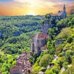 Village of Rocamadour seems to cling to a cliff top surrounded by forests