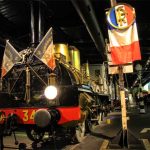 Steam train engine in a vast museum room at the Mulhouse Train Museum, Alsace, France