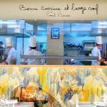 Kitchen of Brasserie Irma Bocuse, Annecy, chefs in tall hats