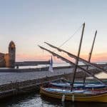 Boat bobbing in the harbour of Collioure at dusk