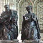 Black marble tom statues of a couple praying at the Saint-Denis Basilica Paris