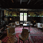 cosy sitting room with wood beams and oak panels at La Grenouillre restaurant northern France