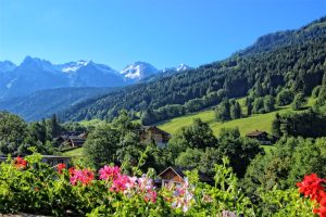 Sun, flowers and verdant mountain views of Le Grand Bornand, Haute Savoie, France
