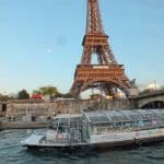 Passenger boat passing by the Eiffel Tower in Paris