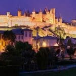 View of the citadel of Carcassonne at night all lit up against a dark sky