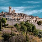 View of the hill top village of St Paul-de-Vence Provence, a wall around the town surrounded by trees