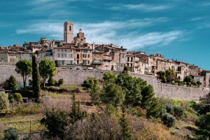 View of the hill top village of St Paul-de-Vence Provence, a wall around the town surrounded by trees